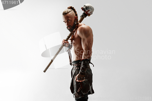 Image of Man in leather viking\'s costume isolated on white studio background