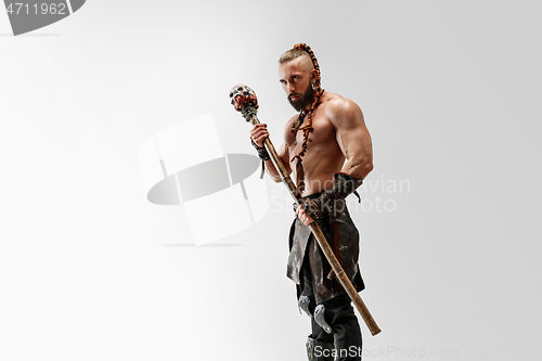 Image of Man in leather viking\'s costume isolated on white studio background