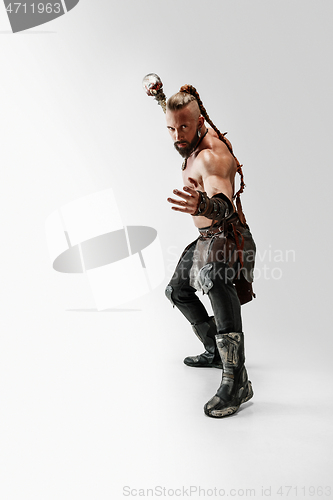 Image of Man in leather viking\'s costume isolated on white studio background