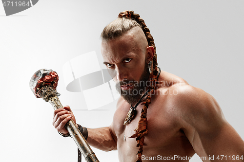 Image of Man in leather viking\'s costume isolated on white studio background