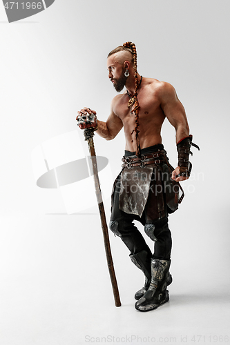 Image of Man in leather viking\'s costume isolated on white studio background