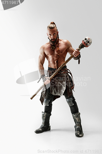 Image of Man in leather viking\'s costume isolated on white studio background