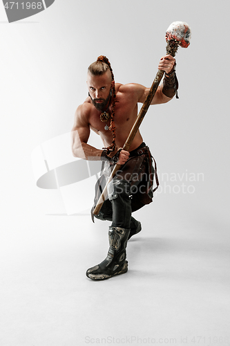 Image of Man in leather viking\'s costume isolated on white studio background