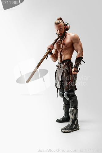 Image of Man in leather viking\'s costume isolated on white studio background