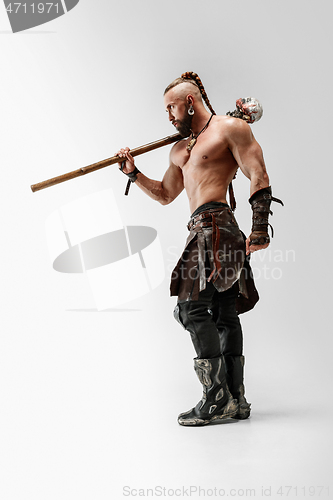 Image of Man in leather viking\'s costume isolated on white studio background