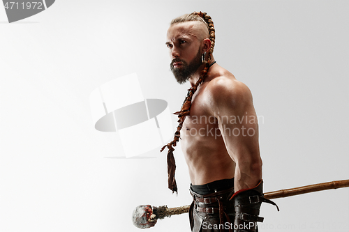 Image of Man in leather viking\'s costume isolated on white studio background