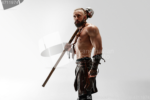 Image of Man in leather viking\'s costume isolated on white studio background