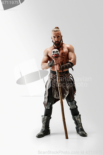 Image of Man in leather viking\'s costume isolated on white studio background