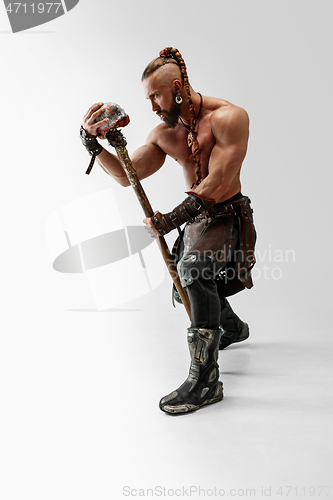 Image of Man in leather viking\'s costume isolated on white studio background