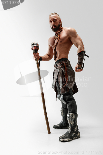 Image of Man in leather viking\'s costume isolated on white studio background