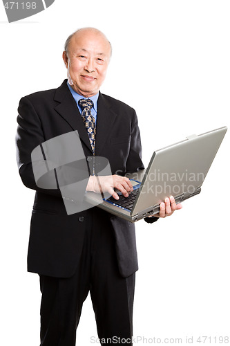 Image of Senior asian businessman and laptop