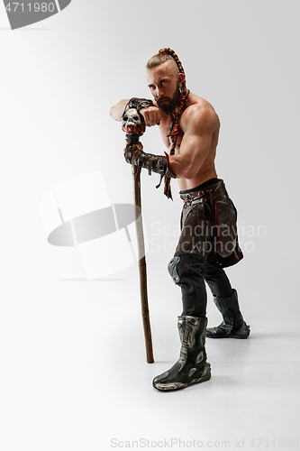 Image of Man in leather viking\'s costume isolated on white studio background