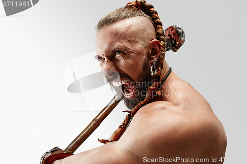 Image of Man in leather viking\'s costume isolated on white studio background