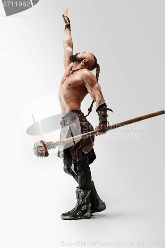 Image of Man in leather viking\'s costume isolated on white studio background