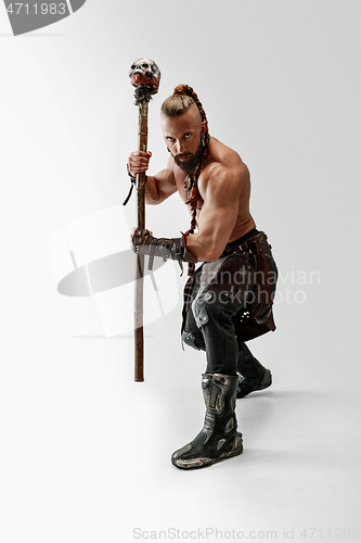 Image of Man in leather viking\'s costume isolated on white studio background