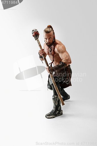 Image of Man in leather viking\'s costume isolated on white studio background