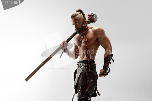 Image of Man in leather viking\'s costume isolated on white studio background