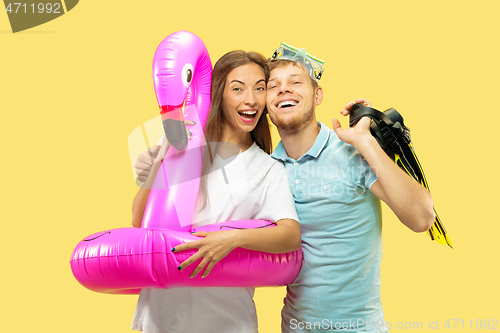 Image of Beautiful couple isolated on yellow studio background