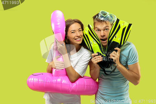 Image of Beautiful couple isolated on green studio background