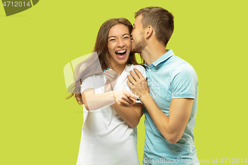 Image of Beautiful couple isolated on green studio background