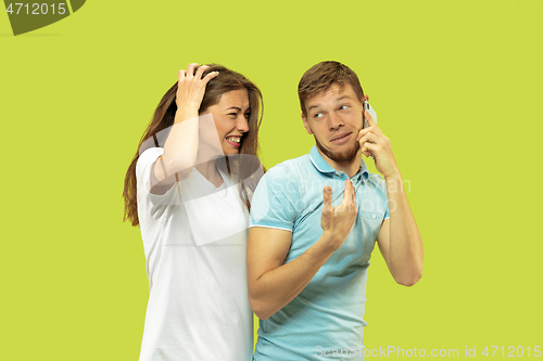 Image of Beautiful couple isolated on green studio background