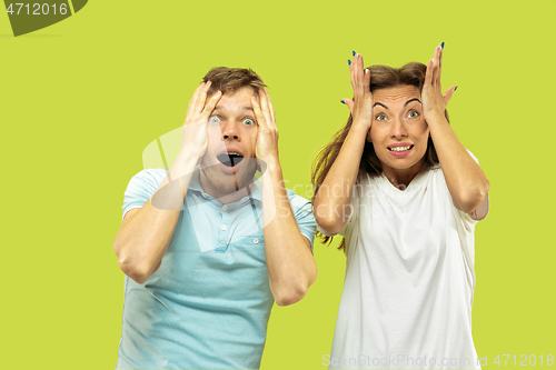 Image of Beautiful couple isolated on green studio background