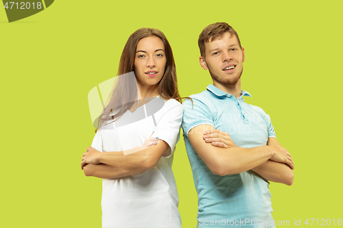 Image of Beautiful couple isolated on green studio background