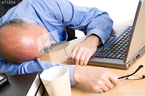 Image of Sleeping senior asian businessman