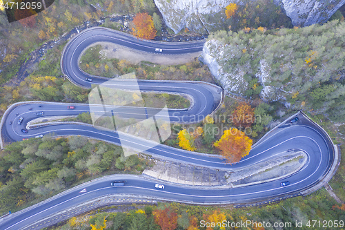 Image of Curvy road in autumn forest