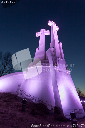 Image of Purple Illuminated Monument of Three Crosses in Vilnius