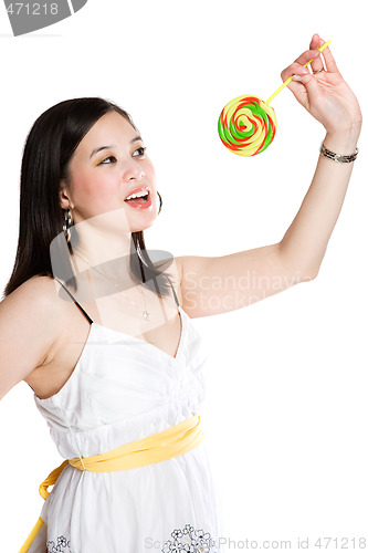 Image of Beautiful asian woman and lollipop