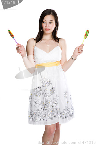 Image of Beautiful asian woman and lollipops