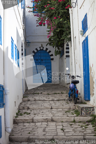 Image of Narrow street with moped