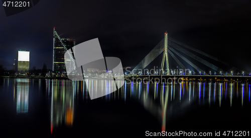 Image of Riga skyline with skyscrapers and suspension bridge