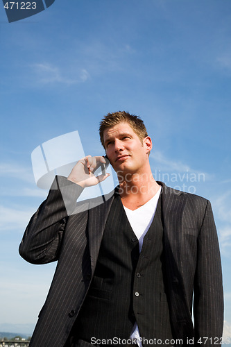 Image of Caucasian businessman on the phone