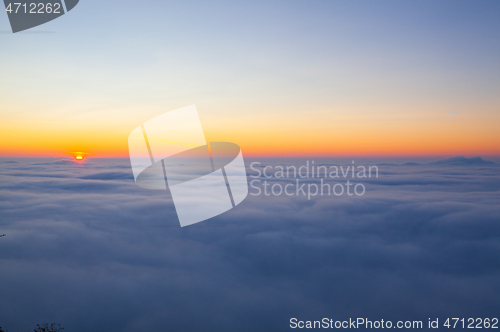 Image of Amazing sunrise above clouds from the top of the mountain 