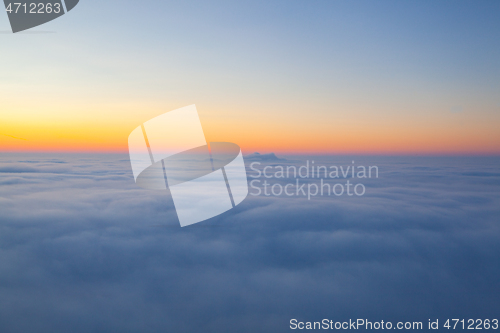 Image of Amazing sunrise above clouds from the top of the mountain 