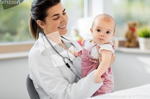 Image of female pediatrician doctor with baby at clinic