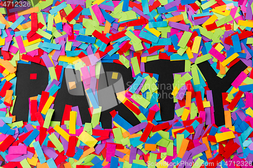 Image of black party word made of multicolored papers