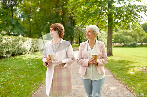 Image of senior women or friends drinking coffee at park