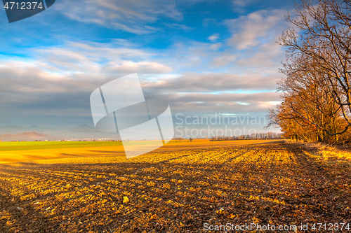 Image of Autumn plowed field at amazing sunrise. Czech Republic