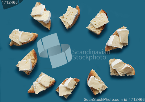 Image of toasted bread slices with brie cheese