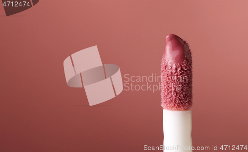 Image of close up of lipgloss brush