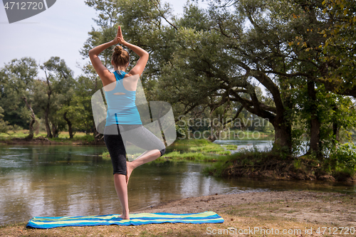 Image of woman meditating and doing yoga exercise