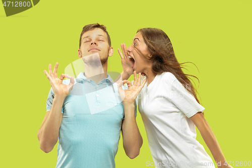 Image of Beautiful couple isolated on green studio background