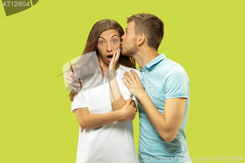 Image of Beautiful couple isolated on green studio background