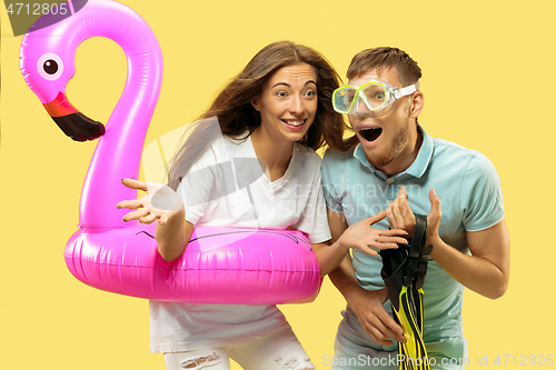 Image of Beautiful couple isolated on yellow studio background