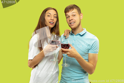 Image of Beautiful couple isolated on green studio background