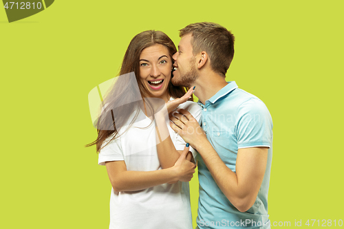 Image of Beautiful couple isolated on green studio background