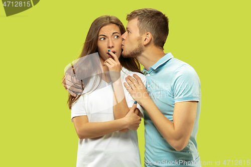 Image of Beautiful couple isolated on green studio background